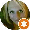 Small picture of one of our homeowners who sold us their house in Joliet IL while living out of state. This is her smiling next to her 5 star review